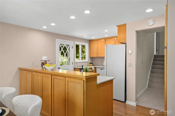 There is deck access directly from the kitchen. This indoor doorway provides easy access throughout the house. There is deck access directly from the kitchen. This indoor doorway provides easy access throughout the house.