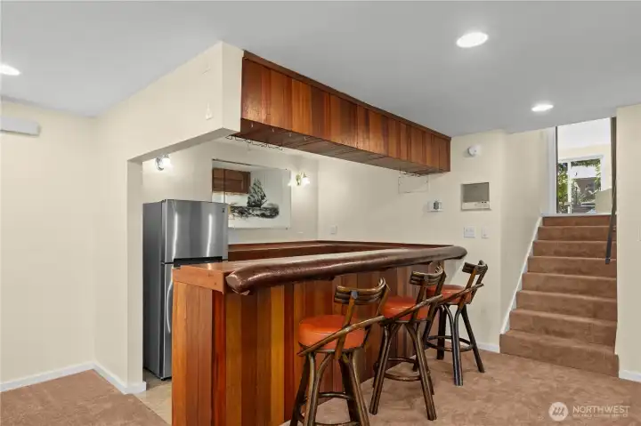 From the main level, another staircase takes you to the fully finished lower level with entertainment bar. From the main level, another staircase takes you to the fully finished lower level with entertainment bar.