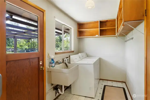 Laundry with sink and cabinets