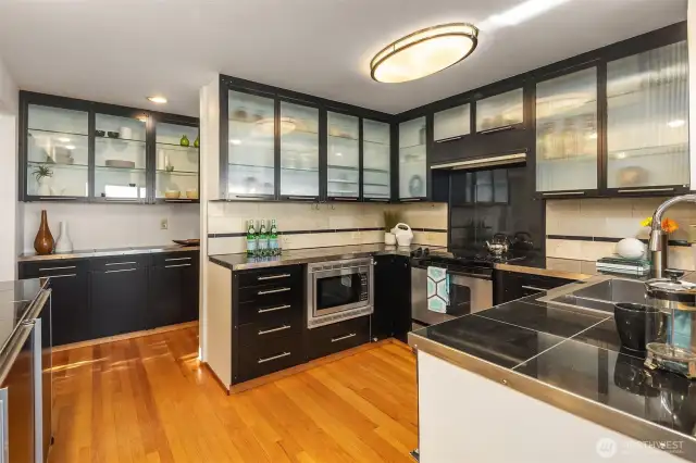 The wall of storage on the back-side of the kitchen is genius.  To the left is that breakfast nook/office space we just saw.