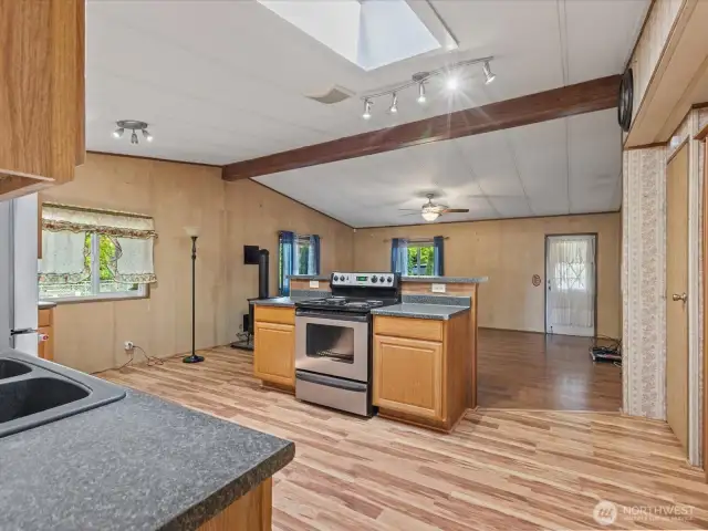 Triple pane windows, sky light, ceiling fan w/light and slightly vaulted ceilings.