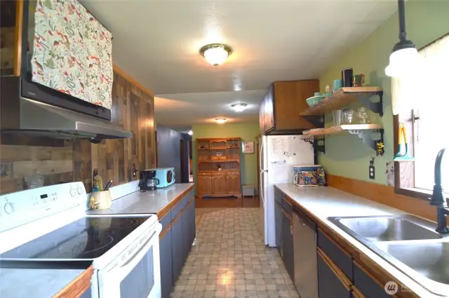 Kitchen with view of the separate gathering room ...