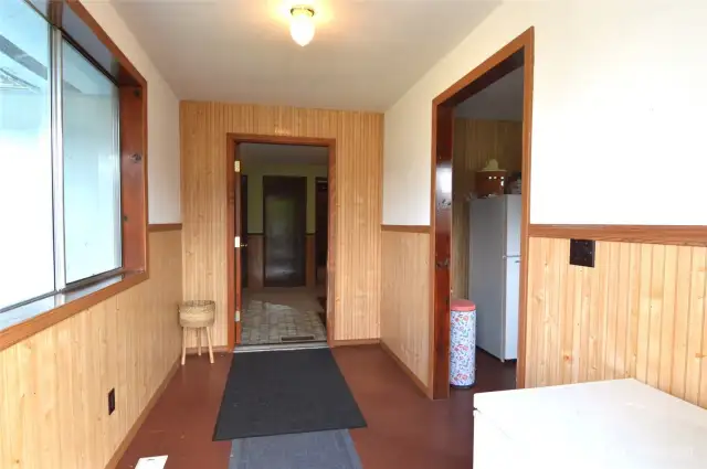 Hallway to the back porch-Notice the extra room on the right side- big enough for an extra sleeping quarters.