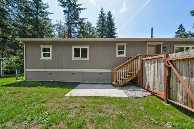 The deck that is off the front door leads to both front & back yard with private patio.