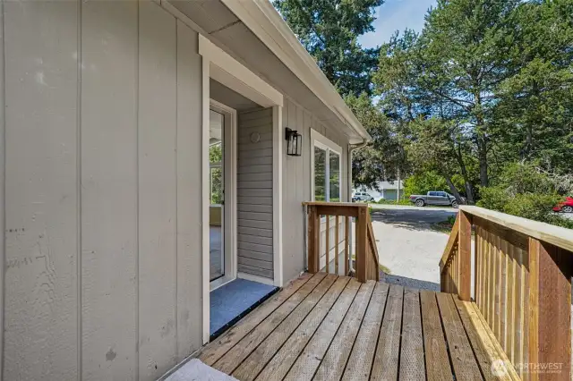 Front deck leads to both front & back yards.