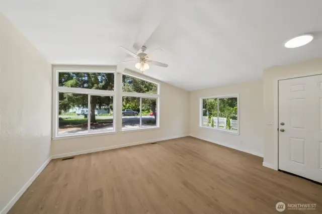 LOVING the light that floods this room from those large windows.