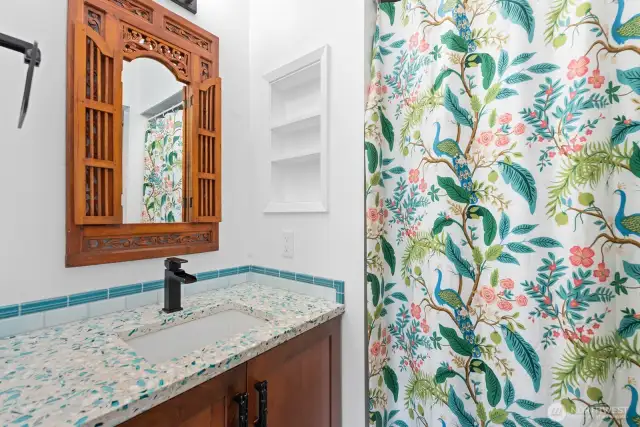 Remodeled Bath with custom Cabinet, Tile Countertops, and Mirror.