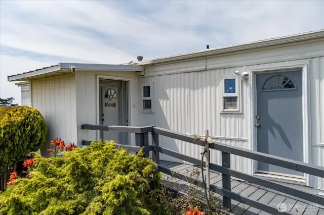 The covered entry makes the perfect place to kick off your shoes & prep to go inside.