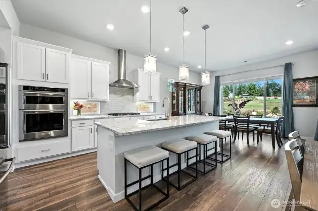 The tall white cabinets provide a sense of height and depth, creating a spacious feel