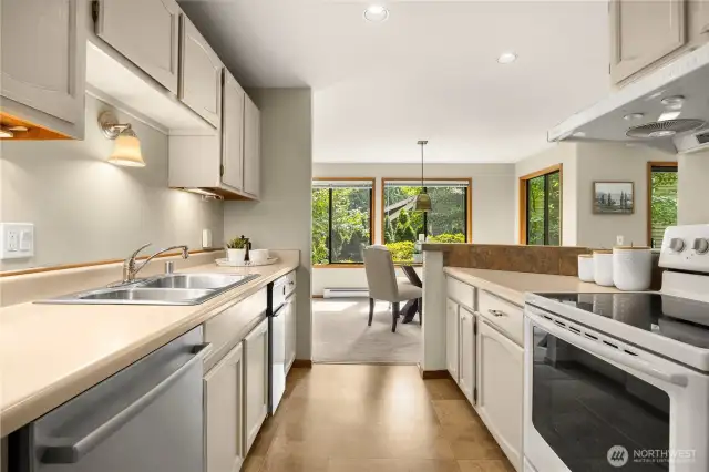 Kitchen has been freshly painted and offers plenty of storage and counter space.