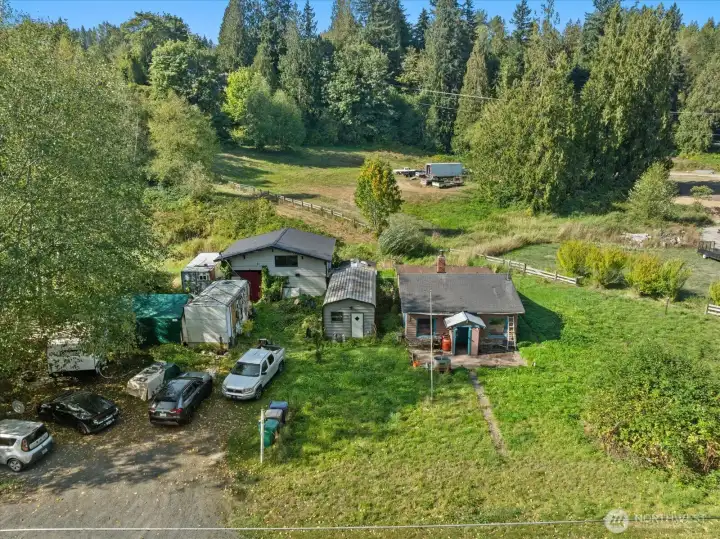 Fixer opportunity in the heart of Machias! Main home + Outbuilding & Shop