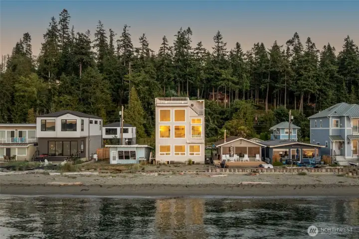 Mutiny Bay Sunset reflects of the wall of windows