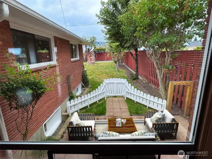View from your living room of the lovely backyard and mountains (not pictured since it was a cloudy day)