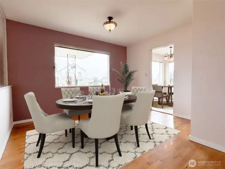 Dining room has a large picture window and is next to the kitchen