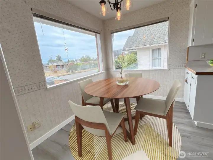 Kitchen eating area has large picture windows