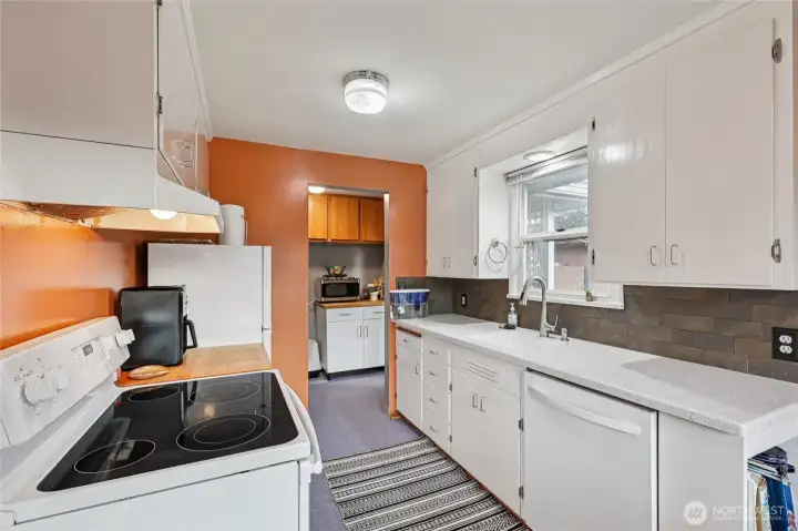 Kitchen with access to the utility room and side entry to the home.