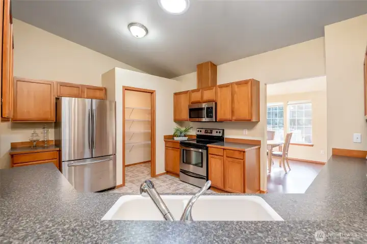 Easy transition space from the kitchen to the dining room creates an easy work flow for home chefs.