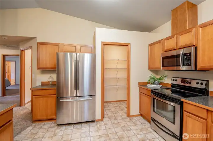 Beautiful storage is offered with a walk-in pantry and paired with sizable cabinetry.