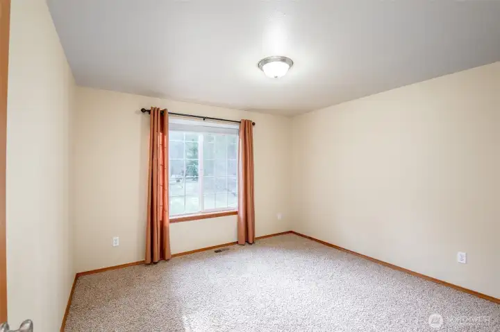 First single bedroom with closet opposing window, showering in more natural lighting.