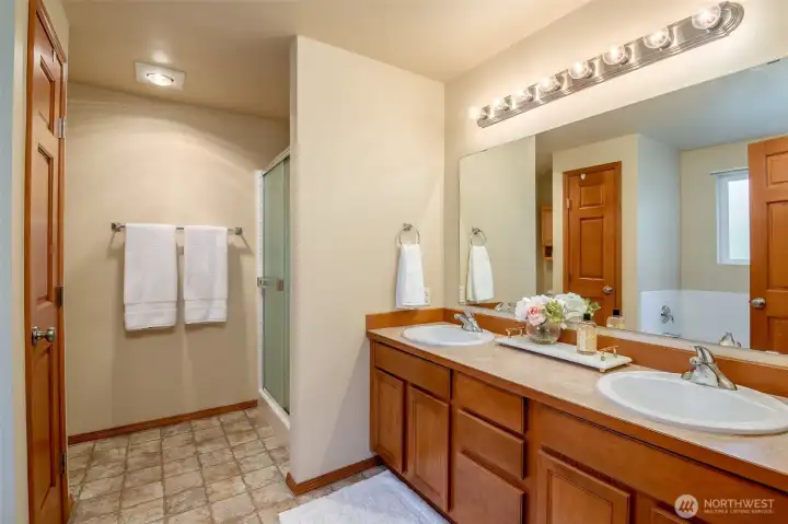 Gorgeous primary bathroom with dual vanity and walk in shower.