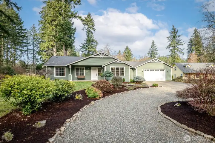 Curved driveway expands parking availability.