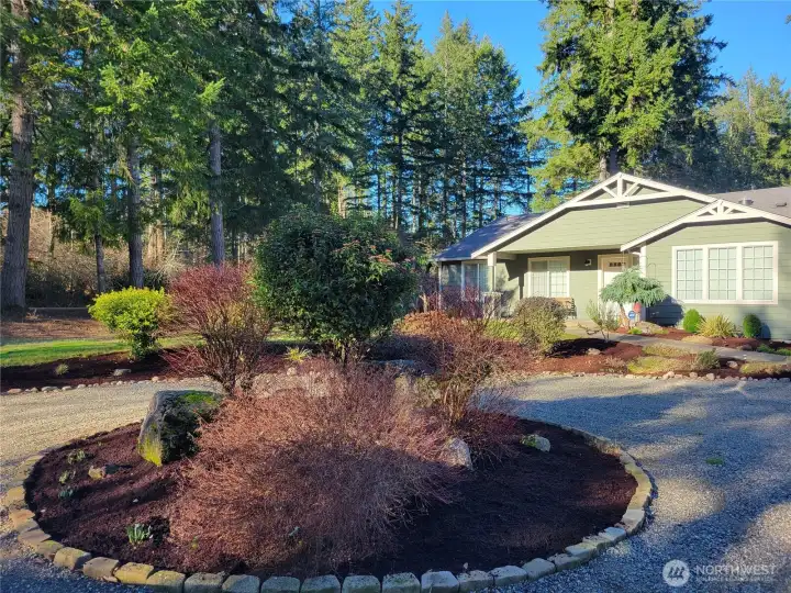 Gorgeous landscape to highlight this gravel driveway.