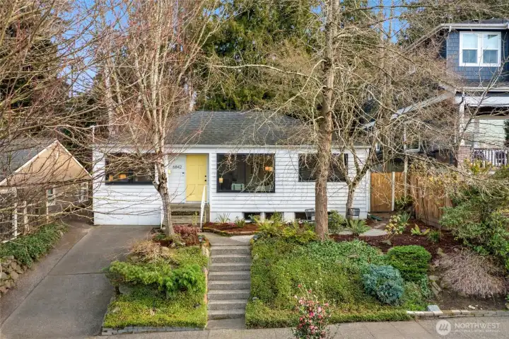 A renovated 1940's Ravenna bungalow, cherishes wide plank hard wood flooring throughout main floor-from a World War II Armory proving warmth & history, picturesque living room window and new-fresh interior paint, cathedral ceilings, updated systems with A/C, gas range and private-serene back yard.