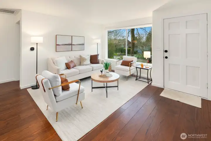 This West facing-renovated 1940's Ravenna bungalow, cherishes wide plank hard wood flooring throughout main floor-from a World War II Armory proving warmth & history, picturesque living room window and new-fresh interior paint.