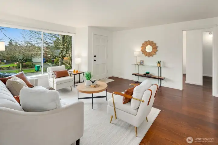 This West facing-renovated 1940's Ravenna bungalow, cherishes wide plank hard wood flooring throughout main floor from a World War II Armory proving warmth and history, picturesque living room window, and all new-fresh interior paint.