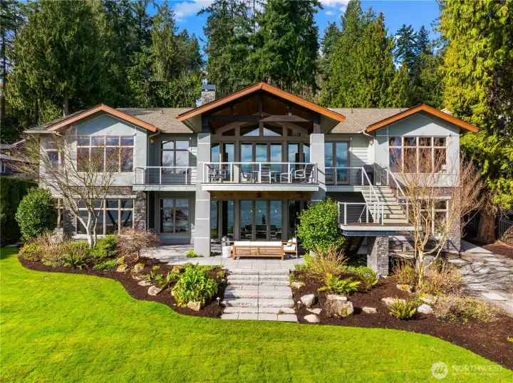 A striking Northwest contemporary set against lush natural surroundings—thoughtfully designed with expansive glass, layered outdoor spaces, and seamless indoor-outdoor living.