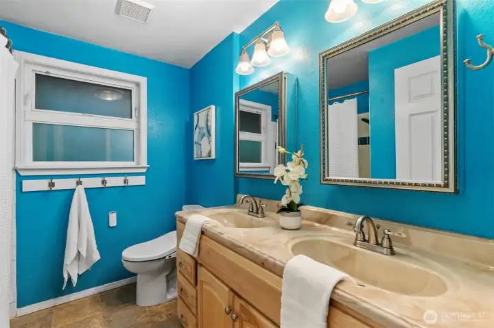 Full bathroom with vanity and shower