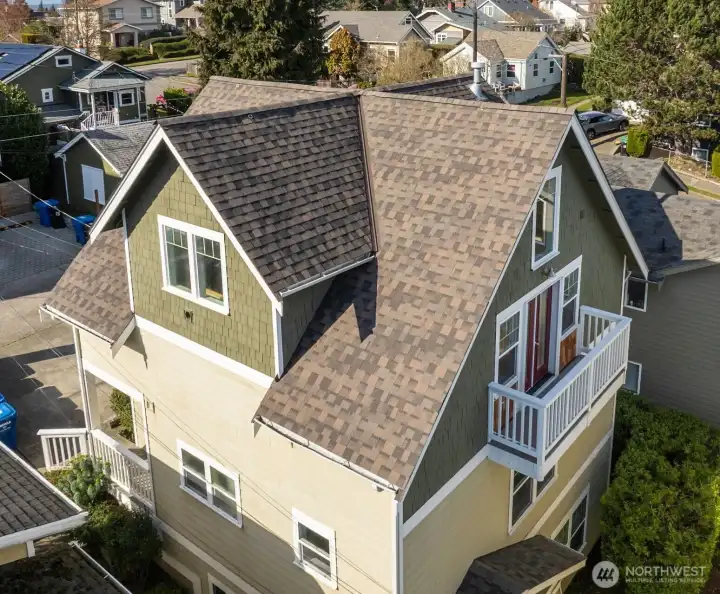 Rare layout lives like a detached home with the neighboring unit located below the main level.