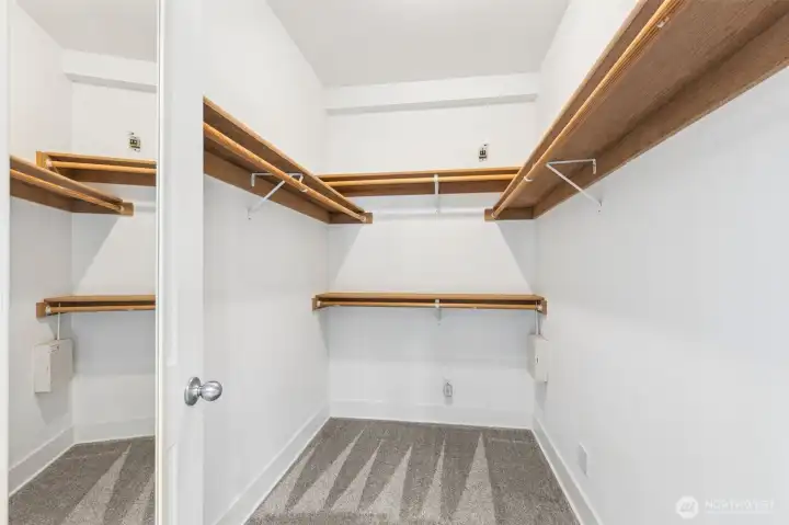 Walk-in closet in the second bedroom suite—both bedrooms feature their own walk-in closets.
