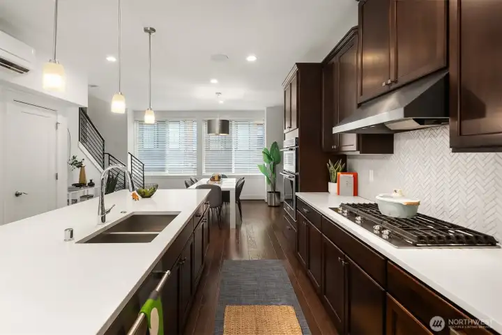 Stairs in the distance lead to the upper level