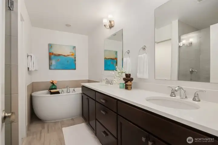Soaking tub and large shower in primary with separate toilet closet