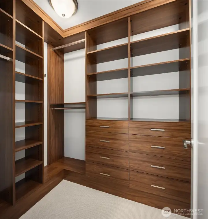 Custom California Closets in primary bedroom.  More behind the door