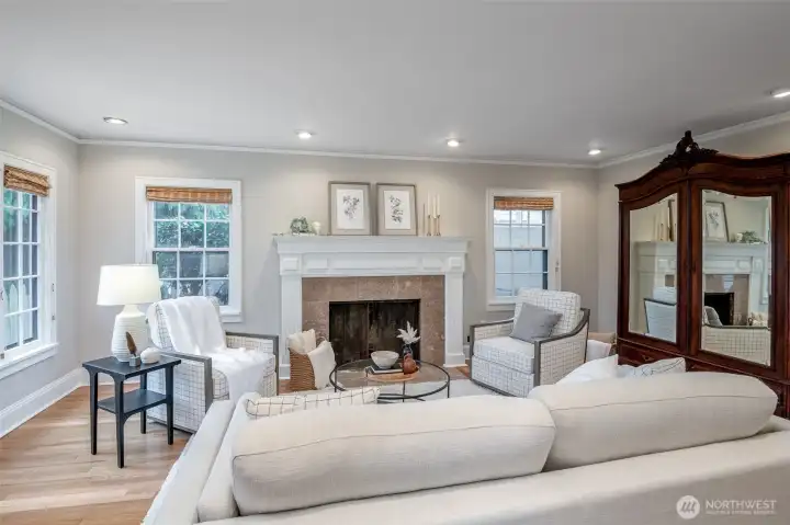 The wood fireplace is a feature to this gorgeous living room