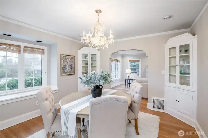 So much charm and beauty in this dining room with the coved archways being mimicked by the built-ins