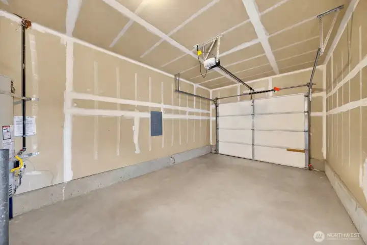 A finished garage is a step away from the utility room.