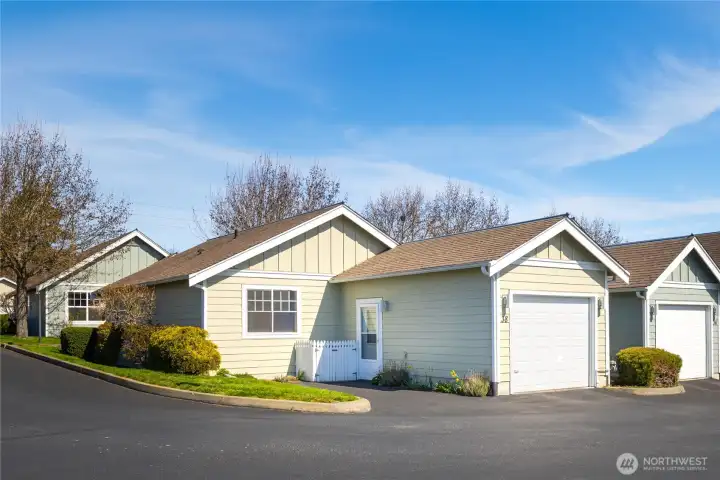 Convenient designated parking sits adjacent to the garage, complemented by additional guest parking within the community. Convenient designated parking sits adjacent to the garage, complemented by additional guest parking within the community.