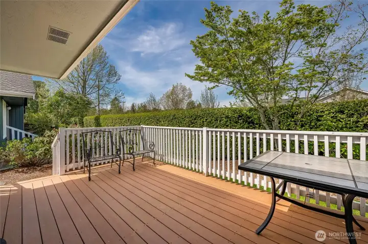 Large composite Deck off the living room at the back of the home.