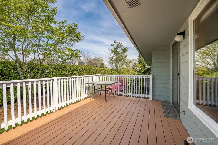 Large composite Deck off the living room at the back of the home.