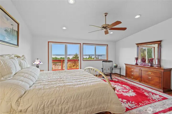 Upstairs is the primary suite with its own balcony.  Wake to views of the sound and the Olympics
