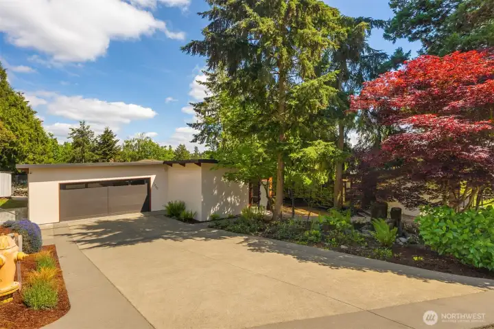 A large 2 car garage with storage space. Also, an extra uncovered parking space to the left of photo. A large 2 car garage with storage space. Also, an extra uncovered parking space to the left of photo.
