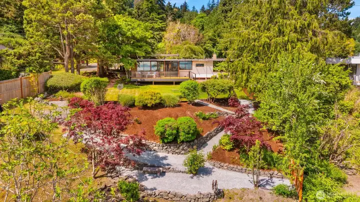 A lush & private property with a path to the community only beach. A lush & private property with a path to the community only beach.