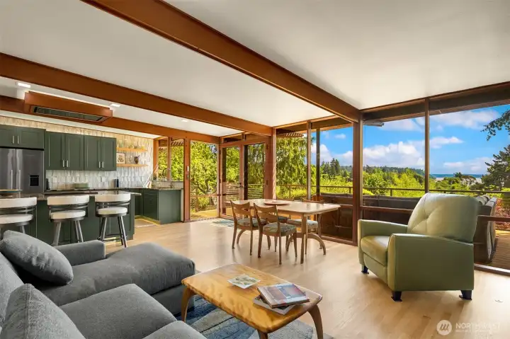 Open kitchen & sitting area with easy flow to the deck. Open kitchen & sitting area with easy flow to the deck.
