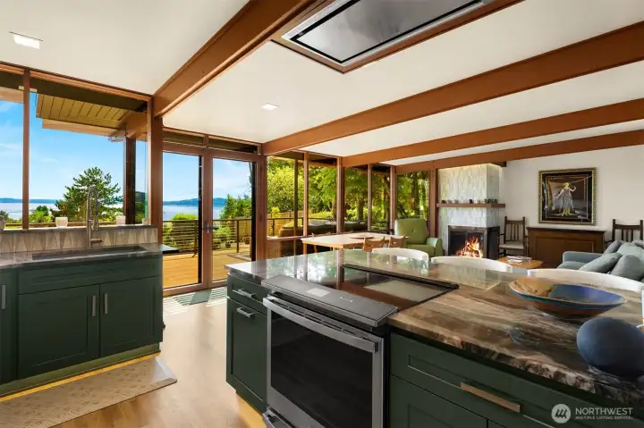 This kitchen has stunning Brazilian quartzite countertops and custom tile work. There is custom remote controlled multi-color manel and cabinetry lighting. This kitchen has stunning Brazilian quartzite countertops and custom tile work. There is custom remote controlled multi-color manel and cabinetry lighting.
