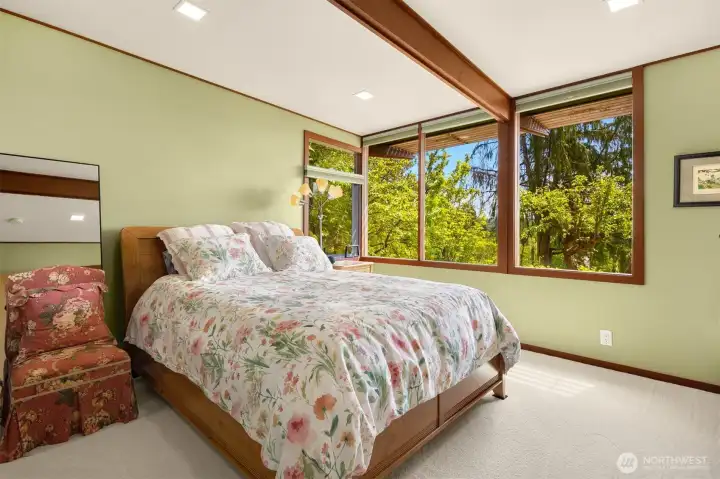 Primary bedroom with a new, large window to capture the stunning views. Primary bedroom with a new, large window to capture the stunning views.