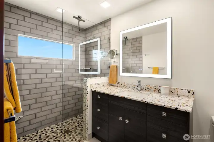 New primary bathroom with a view of the sound & heated floors! New primary bathroom with a view of the sound & heated floors!