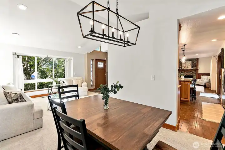 Spacious and open-concept layout featuring a large living area and dedicated dining space, perfect for entertaining. Spacious and open-concept layout featuring a large living area and dedicated dining space, perfect for entertaining.